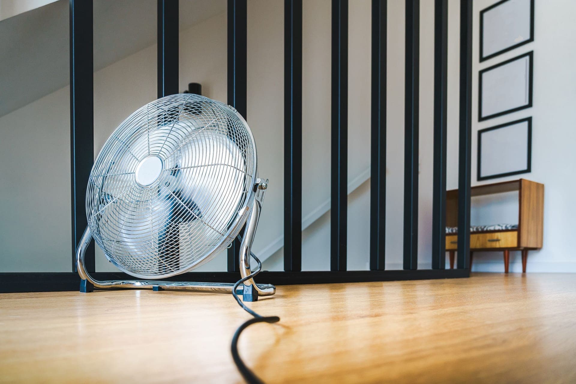 A high-velocity floor fan in an indoor training space - the first accessory every pain cave needs