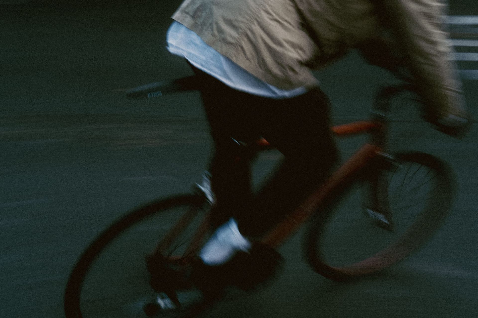 A road bike mounted on a direct-drive smart trainer in a home pain cave